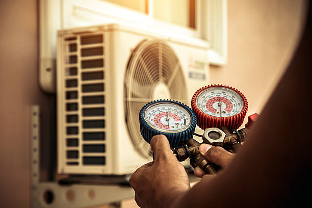 Professional Air Conditioning Service technician working in Garland, TX